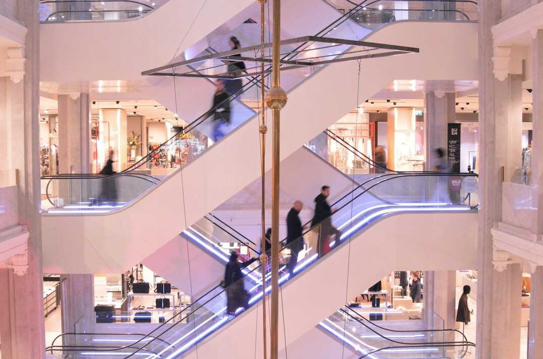 group of shoppers in mall