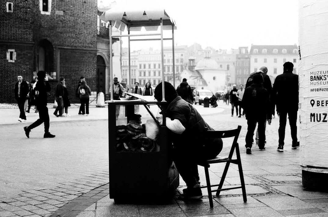 Two Polish readers discussing a book together at a table